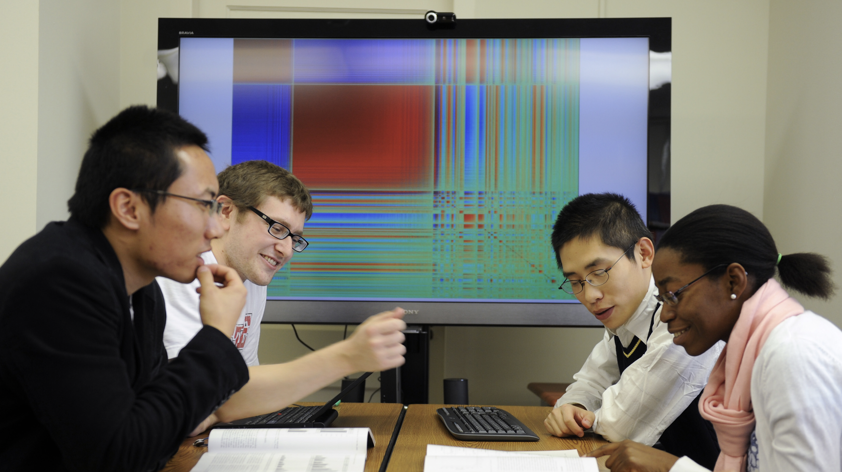 Statistic researchers in a meeting room.